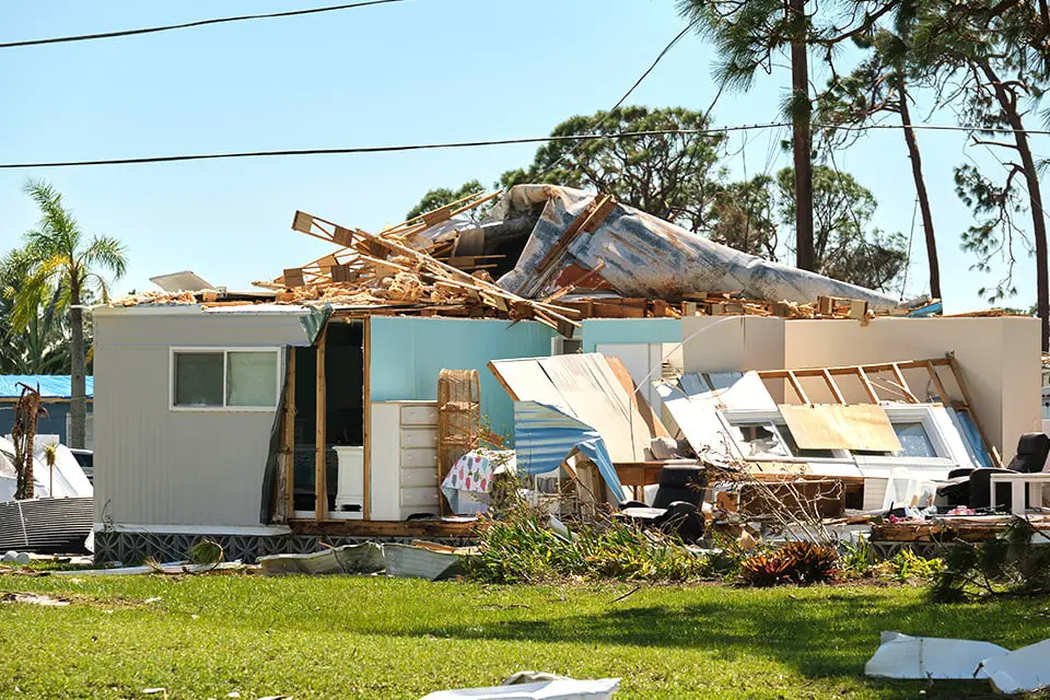 Roofless home with debris