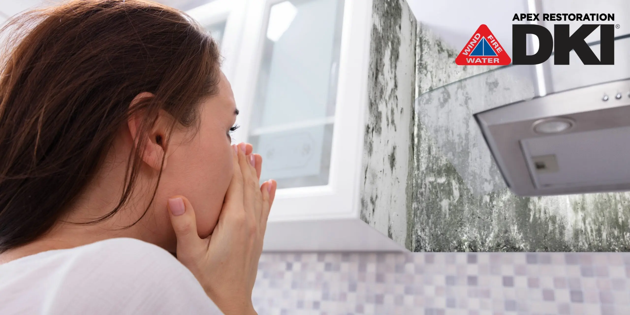 Mold infestation alarming woman in the kitchen